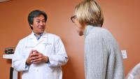 A gynecologist discusses the effects of menopause with a patient